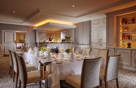 A dining room set for dinner at the Hodson Bay Hotel